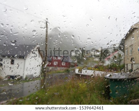 Raindrops on the car window.  Enroute. Sad mood. 