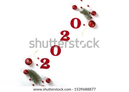Happy New Year 2020 .Photo frame,spruce branch and ball decoration isolated on white background.Flat lay, top view, copy space.