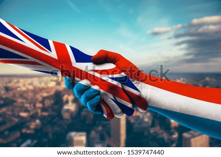 Shaking hands UK and Luxembourg