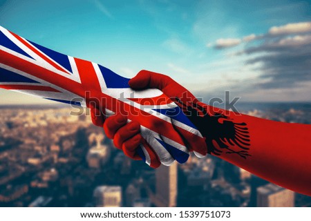 Shaking hands UK and Albania