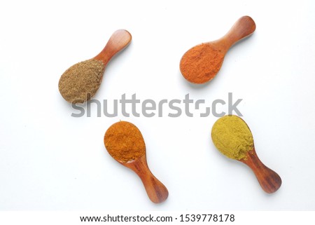 A high  key flatlay closeup picture of Turkish mix spices, coriander, paprika and curry before marinating food.