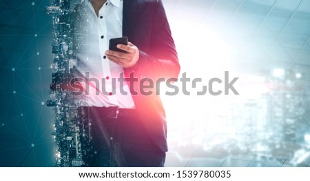 Double Exposure Image of Business Communication Network Technology Concept - Business people using smartphone or mobile phone device on modern cityscape background.