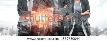 Corporate business partner stand in city background showing partnership and teamwork. The three business partner work as corporate business to utilize strength of their partnership . Royalty-Free Stock Photo #1539780044