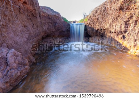 A small waterfall that is blurred
