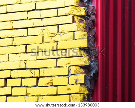 yellow brick wall and red iron wall