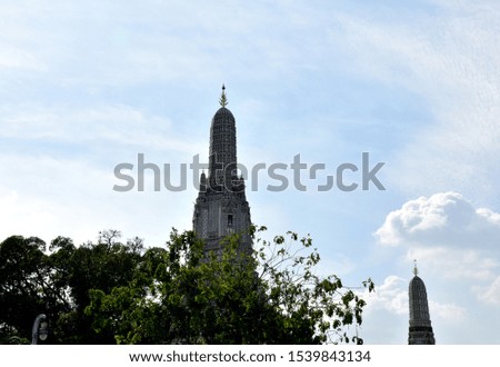 Ancient buddhist Pagoda at Wat Arun with Blue Sky background, Thailand. Clear day and good weather in the morning.