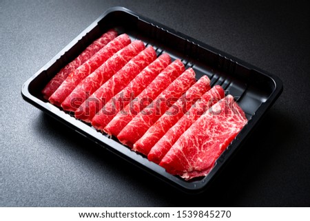 fresh beef raw sliced with marbled texture served for Sukiyaki and Shabu or Yakiniku