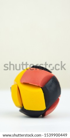 Colorful rubber puzzle ball isolated on white background.