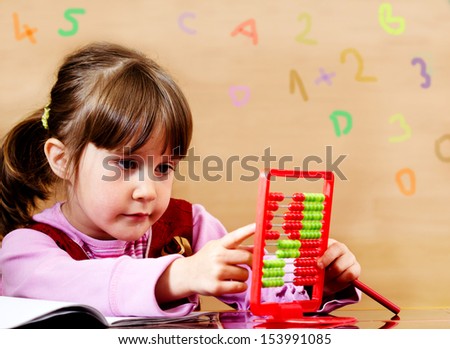 Lovely little girl learning with abacus