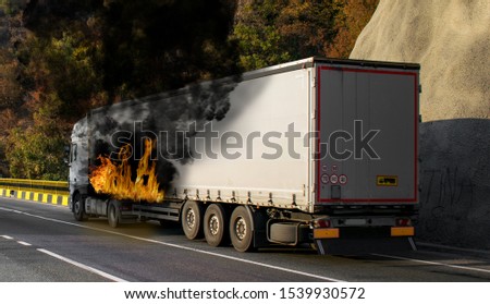 The fire of a truck carrying cargo. The truck's container is in fire. Fire struck the truck. A truck burning Royalty-Free Stock Photo #1539930572