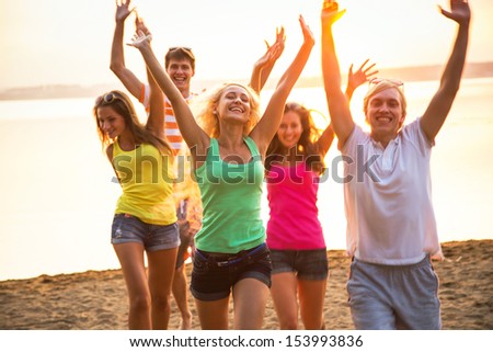 Group of young people at the beach of sea