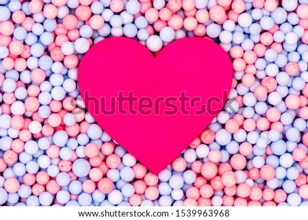 Pink plastic Heart in the middle Pastel color Circle ball Styrofoam or Polystyrene foam texture background