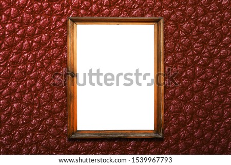 frame on a textural brown wall. isolated on white