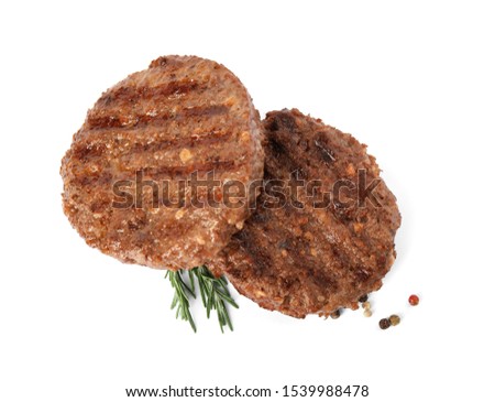 Grilled meat cutlets for burger isolated on white, top view