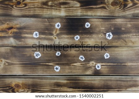Drawing stars sketch on paper on wooden background