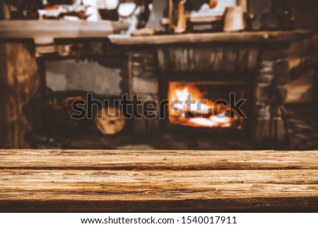 Table background of free space for your decoration and fireplace in home interior 
