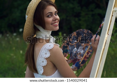 young slender woman with a beautiful smile in the fresh air