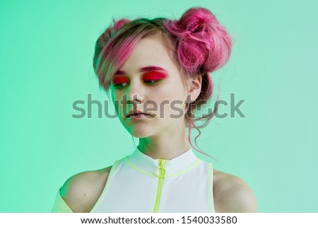 young slender woman with beautiful hair looking at the camera
