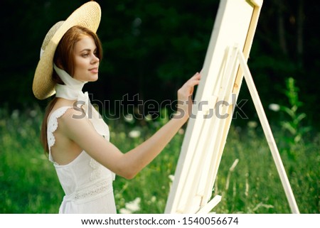 young slender woman resting outdoors model in hat