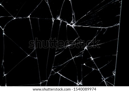 cracked glass isolated on a black background. broken 