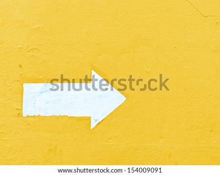 The white arrow on a wall