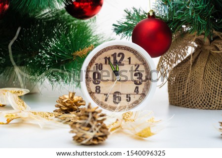 Christmas or New Year. Christmas tree, bright balls and a clock. Greeting card.