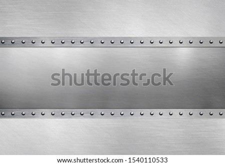 Polished metallic plate on steel background