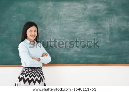 asian woman teach their students in the school
