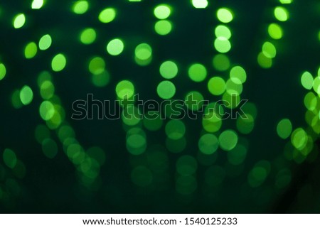 Green abstract bokeh night in city background.