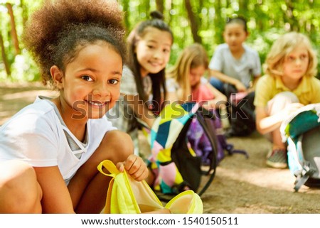African girl and friends take a rest on the tour Royalty-Free Stock Photo #1540150511