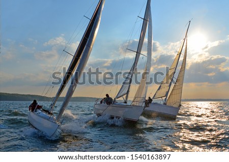 regatta sailing yacht sky sunset Royalty-Free Stock Photo #1540163897