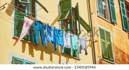 Laundry drying on the rope in Riomaggiore, one of five famous villages of Cinque Terre in Liguria, Italy