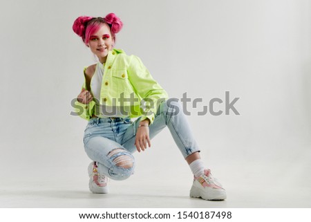 young stylish woman looking at the camera model in jeans