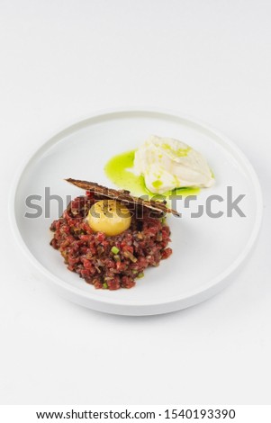 Beef tar tar with raw meat and chicken egg yolk– stock image