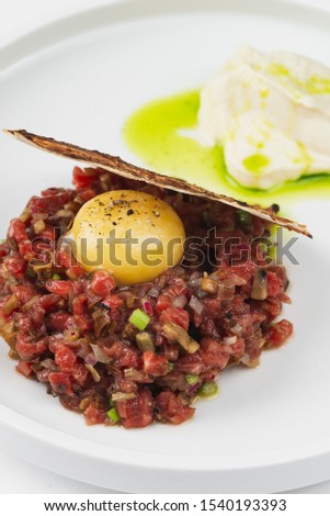 Beef tar tar with raw meat and chicken egg yolk– stock image