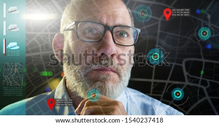 Autonomous Electric cars driving on computer screen with technology assistant tracking information, showing details. fleet management concept  Royalty-Free Stock Photo #1540237418