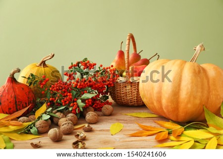 Beautiful autumn composition with harvest on wooden table