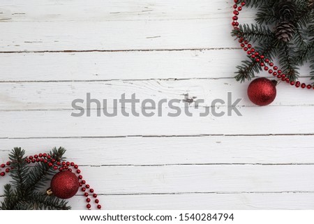 New Year's background. Spruce branches on a wooden table. Ornaments for the New Year tree. Christmas concept
