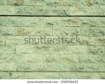 dirty green natural stone walls