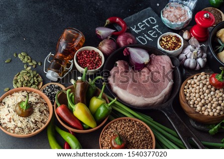 Keto diet concept with ingredients on stone background