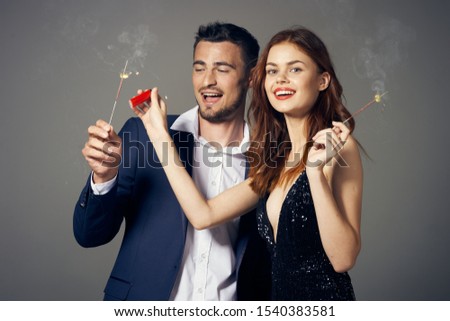 Young people corporate disco party champagne fireworks gray background