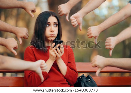 Woman Getting Negative Reactions on Social Media Post. Girl suffering from cyber bullying feeling depressed
 Royalty-Free Stock Photo #1540383773