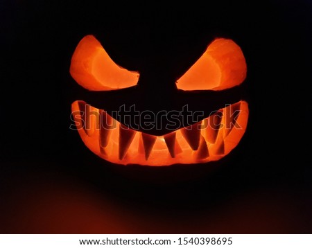 Halloween pumpkin smile and scary eyes for party night. 