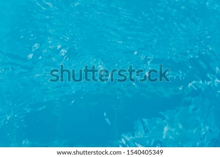 Top view of clear blue water surface on the pool.