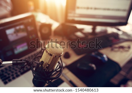 Condenser microphone golden in the studio recording creating the sound effect for the content creator  Royalty-Free Stock Photo #1540480613