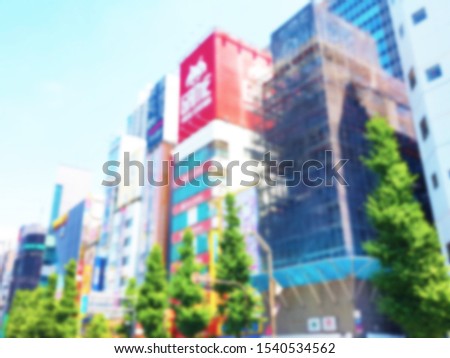 Blurred defocus cityscapes background of Japanese downtown that have a lot of the modern colorful tall buildings.