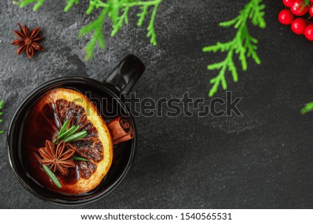 Christmas mulled wine on a wooden table. Traditional hot drink at Christmas (red wine with spices, New Year's Eve, Noel holiday festive) negroni  cocktail. food background. copy space. Top viev