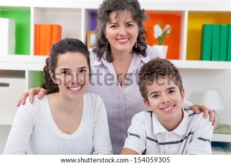 Portrait of happy mother with her son and daughter