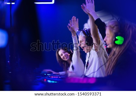 Team professional gamer playing winning tournaments online games computer. Royalty-Free Stock Photo #1540593371