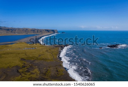 Reynisfjara Black Sand Beach, South Coast Iceland. View from dyrolaey. Panorama. Afternoon. Aerial drone shot, september 2019
